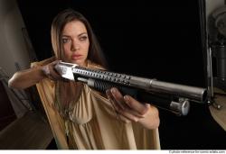 Woman Adult Average White Standing poses Casual Fighting with shotgun